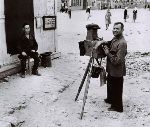 Portrait photographer on the streets of Stalingrad, August 1947, by Robert Capa