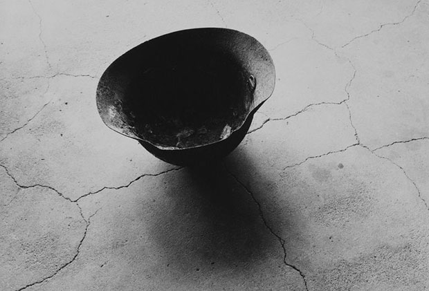 Shomei Tomatsu Steel Helmet with Skull Bone Fused by Atomic Bomb, Nagasaki 1963 © Shomei Tomatsu - interface. Courtesy of Taka Ishii Gallery, Tokyo