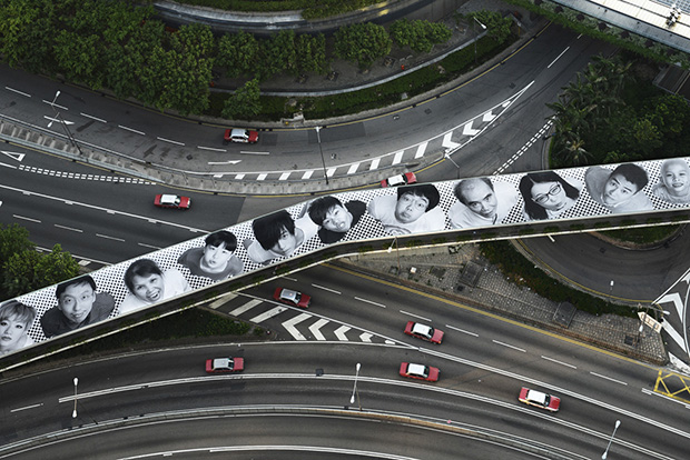 Inside Out Project, Installation on the Connaught Road Central Footbridge, 2012, 2012©JR-­?ART.NET, Courtesy Galerie Perrotin