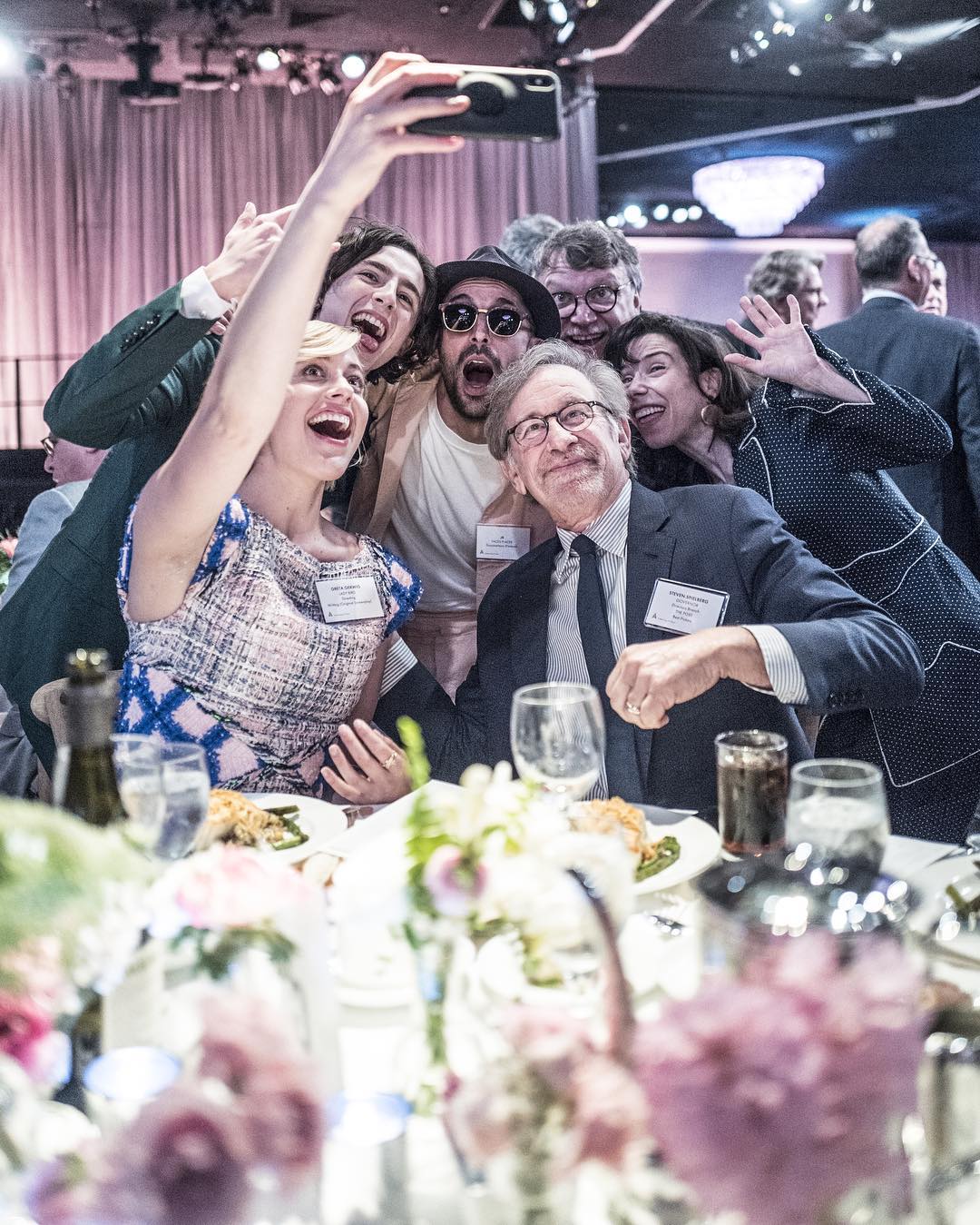 JR (top centre) with (from left) Greta Gerwig, Timothée Chalamet, Stephen Spielberg, Guillermo del Toro, and Sally Hawkins. Photo by Marc Azoulay, image courtesy of JR's Instagram 