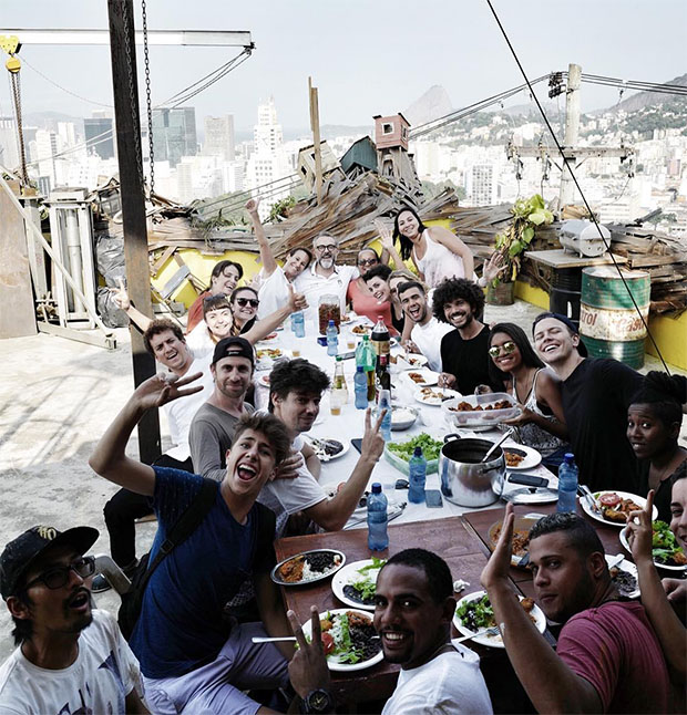 Massimo Bottura, his wife Lara Gilmore and chef Jura (head of the table) enjoy lunch at Casa Amarela with JR and his crew. Image courtesy of JR's Instagram