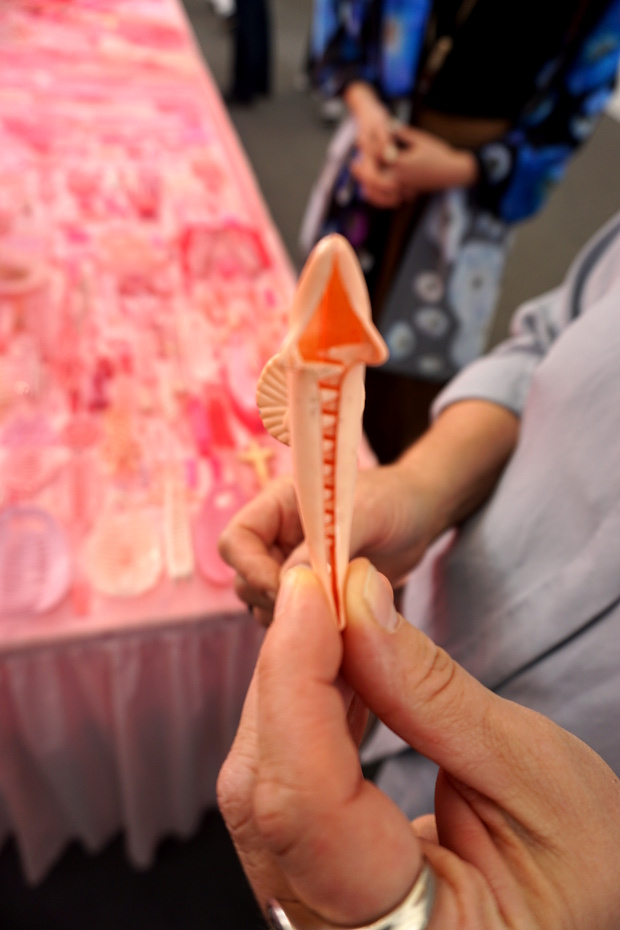 Portia Munson holds her dolphin hairclip at Frieze, 2016. Photograph by Alex Rayner