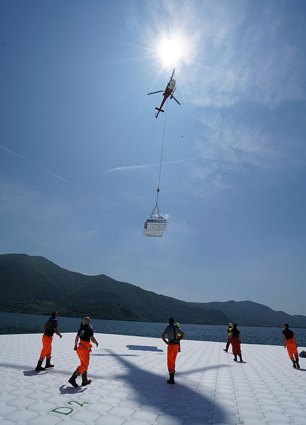 he felt that will cover the cubes underneath the yellow fabric is transported from Montecolino to San Paolo island by Elimast Helicopter Service, May 2016  Photo: Wolfgang Volz 