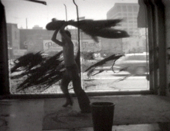 Whipping a Window and a Wall with Paint (1974) by Paul McCarthy
